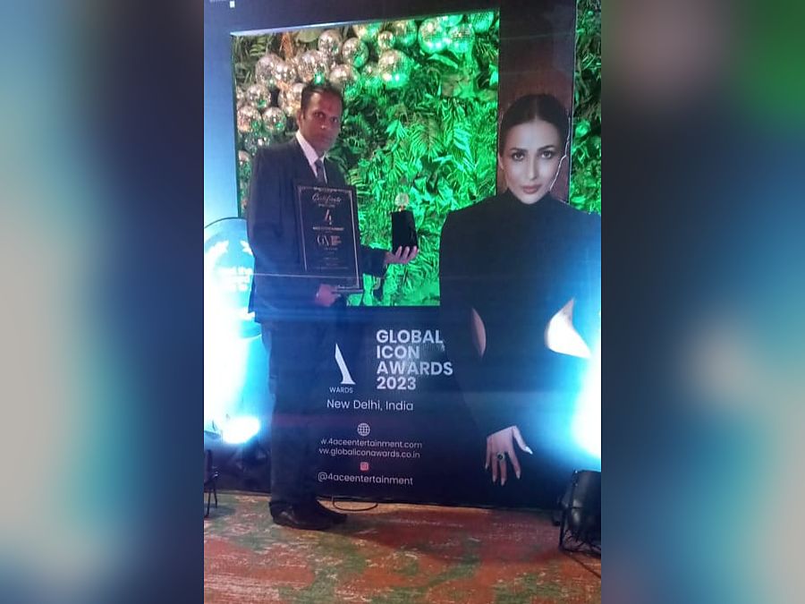 On stage with the Global Icon Award trophy