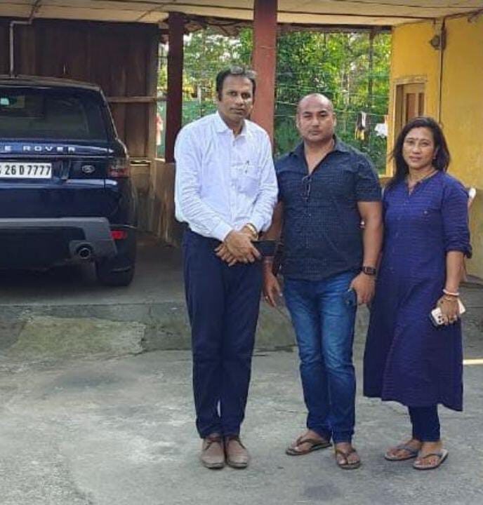 With clients outside their residence during a site visit