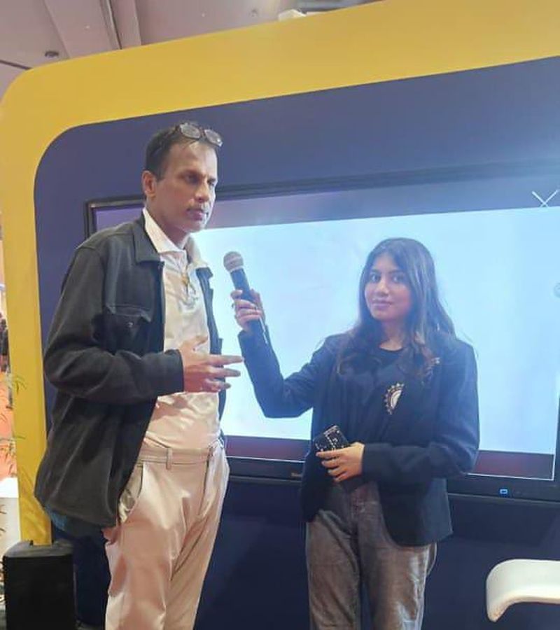 On stage with a microphone at a live audience session