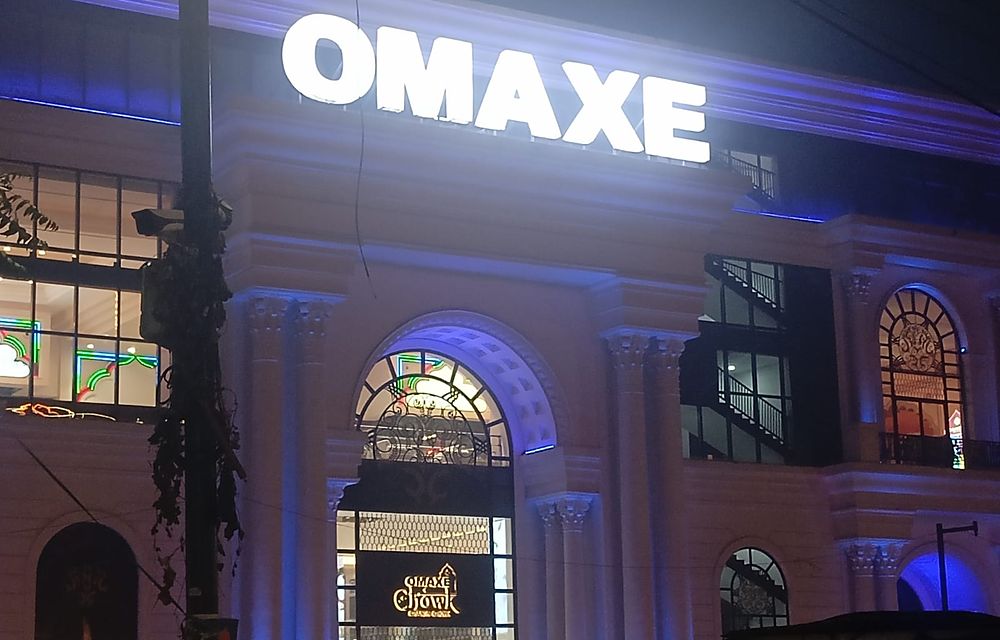 Illuminated Omaxe commercial complex at night