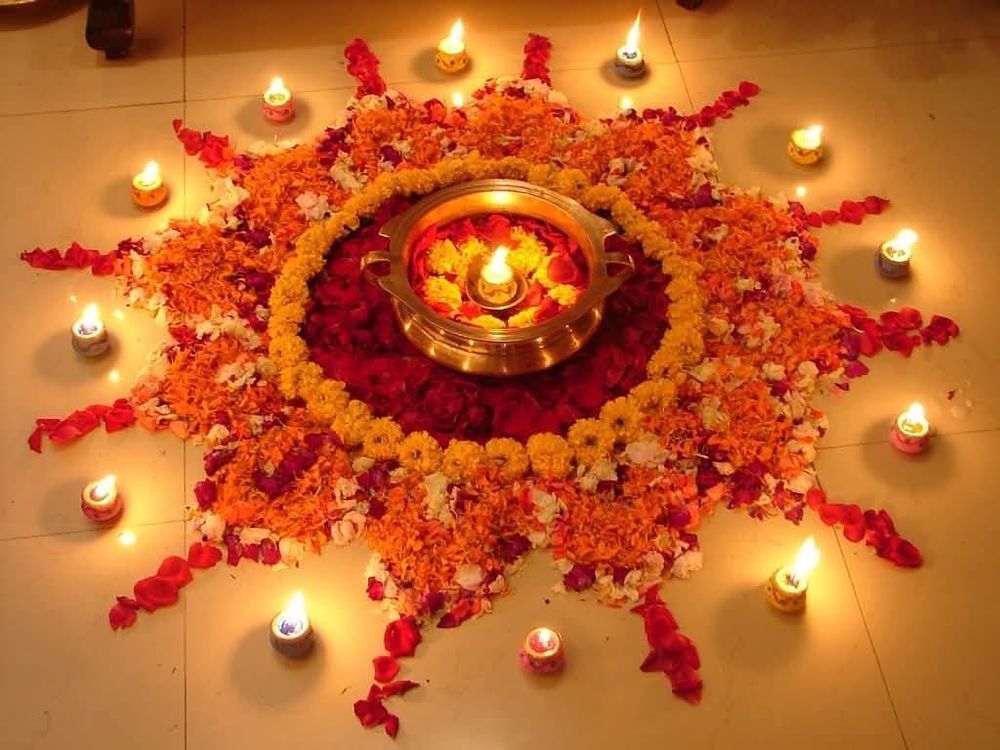 Rangoli and diyas lit for a spiritually energised space